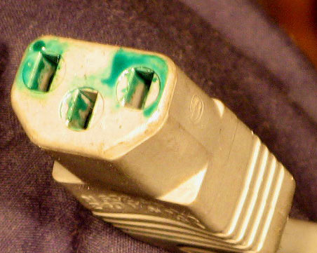 IEC plug with strange green goop